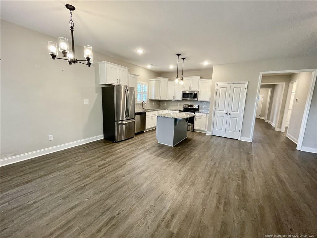 5177 Maxwell Road Stedman, NC 28391 - Photo 5 of 24 a view of a kitchen and refrigerator