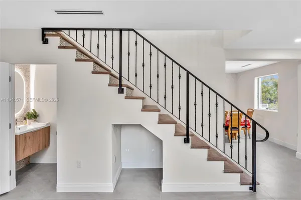 a dining room with furniture and window