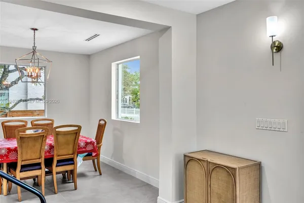 a view of roof deck with outdoor seating and city view
