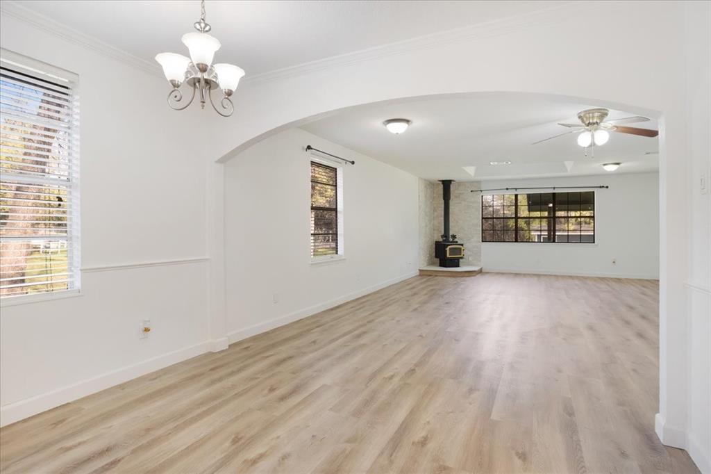 186 Mill Creek Resort Road Pottsboro, TX 75076 - Photo 12 of 35 wooden floor in an empty room with a window