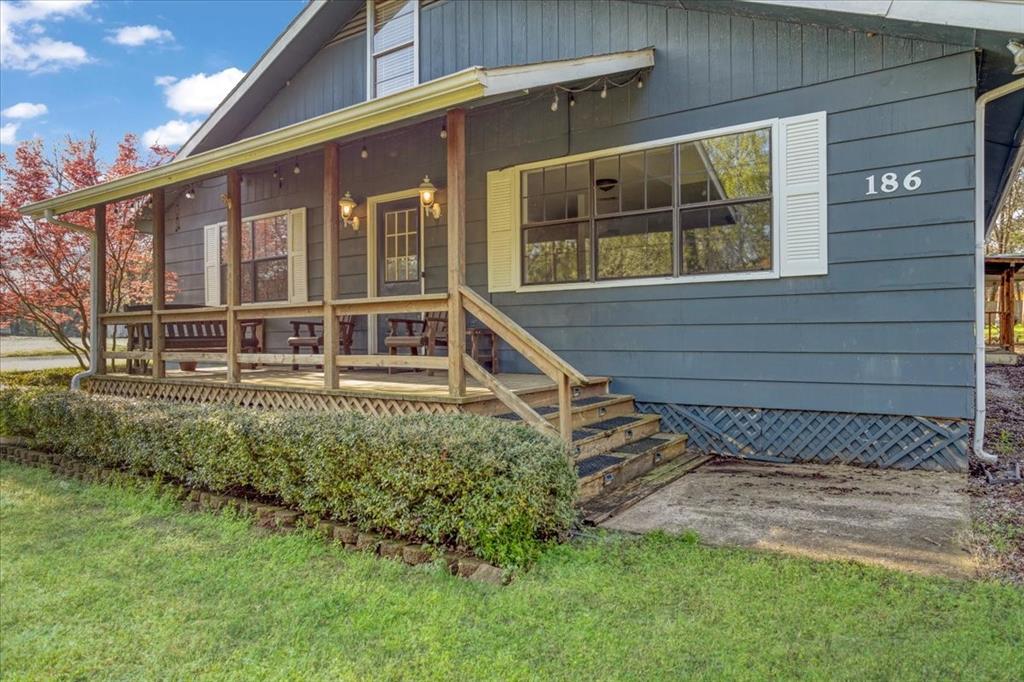 186 Mill Creek Resort Road Pottsboro, TX 75076 - Photo 4 of 35 a house view with a outdoor space