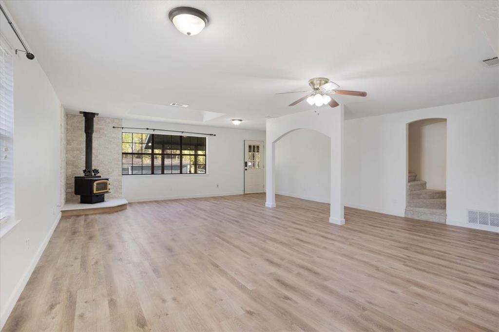 186 Mill Creek Resort Road Pottsboro, TX 75076 - Photo 7 of 35 wooden floor in an empty room with a window