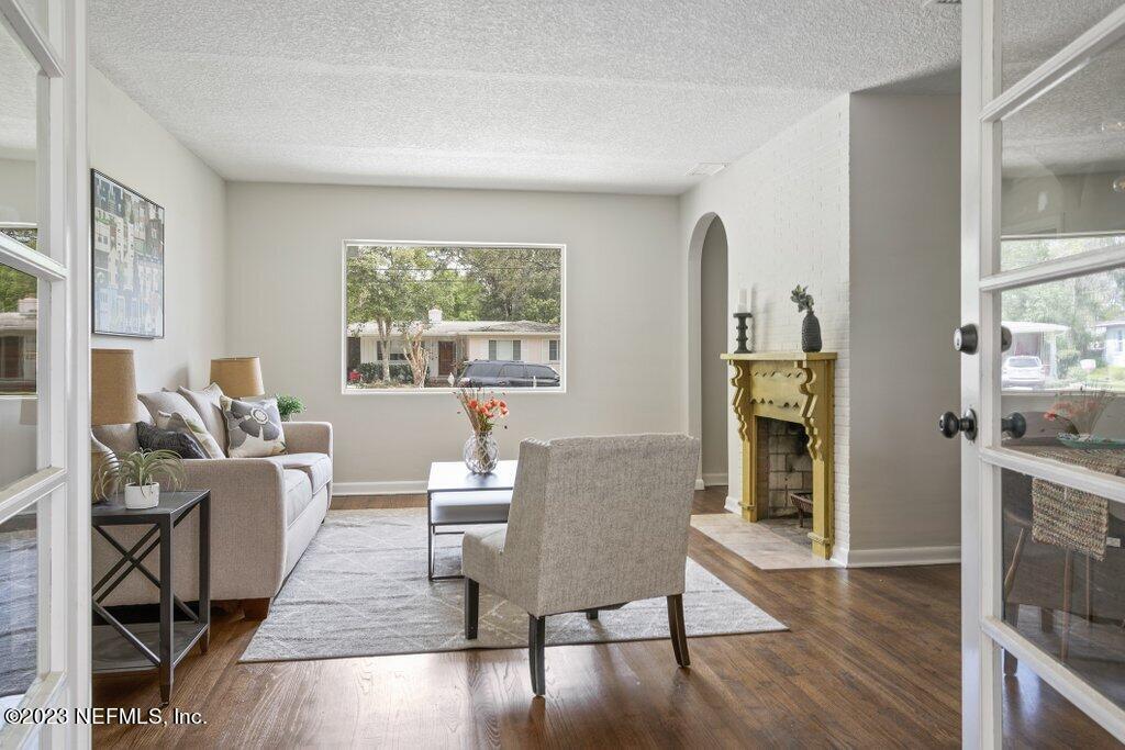 6404 Wesleyan Road Jacksonville, FL 32217 - Photo 12 of 45 a living room with furniture and a table