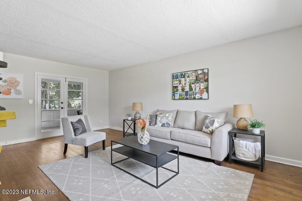 6404 Wesleyan Road Jacksonville, FL 32217 - Photo 13 of 45 a living room with furniture and wooden floor
