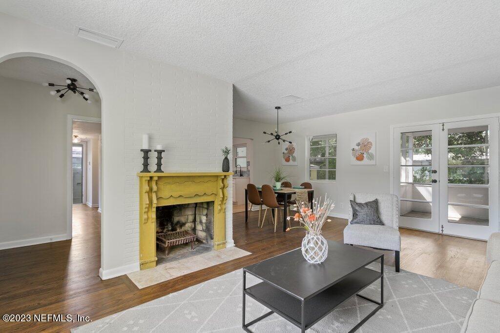 6404 Wesleyan Road Jacksonville, FL 32217 - Photo 14 of 45 a living room with furniture and a fireplace