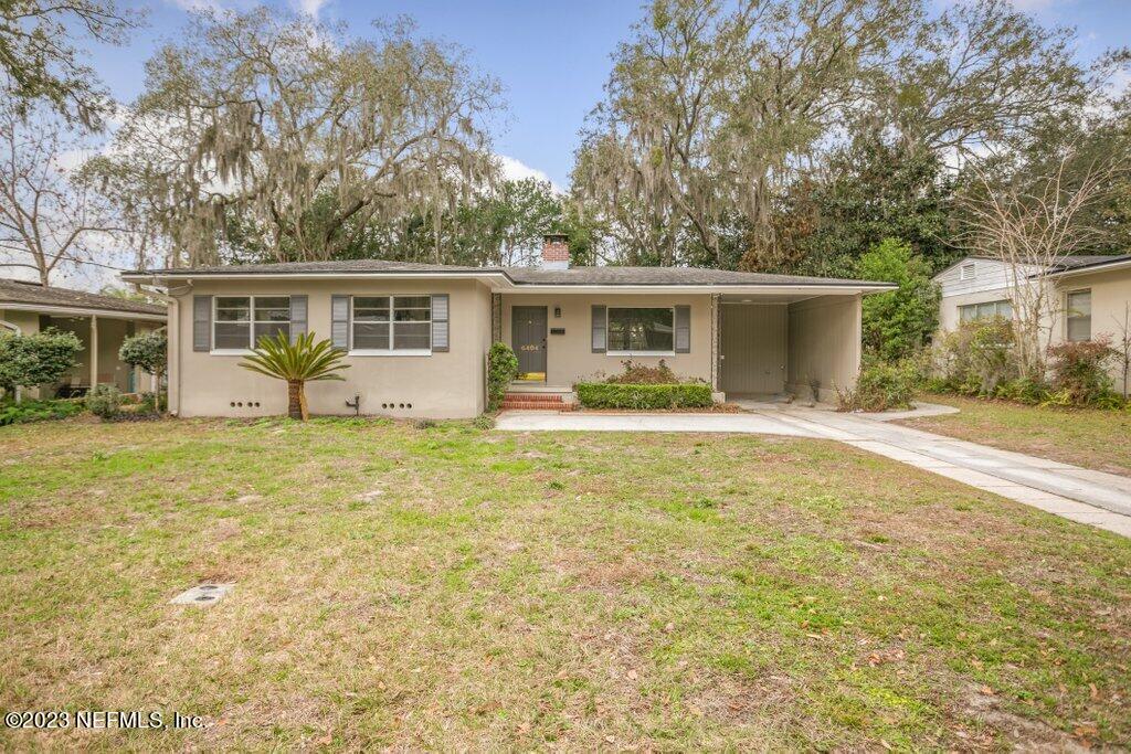 6404 Wesleyan Road Jacksonville, FL 32217 - Photo 2 of 45 a view of a house with a yard