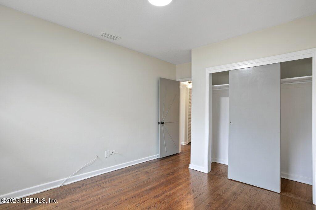6404 Wesleyan Road Jacksonville, FL 32217 - Photo 25 of 45 a view of an empty room with wooden floor