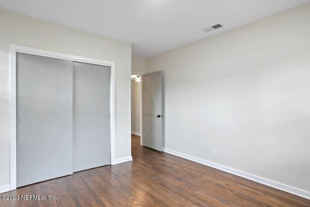6404 Wesleyan Road Jacksonville, FL 32217 - Photo 27 of 45 a view of an empty room with wooden floor