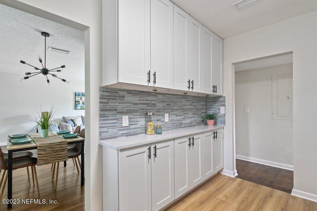 6404 Wesleyan Road Jacksonville, FL 32217 - Photo 7 of 45 a kitchen with stainless steel appliances granite countertop a sink and cabinets