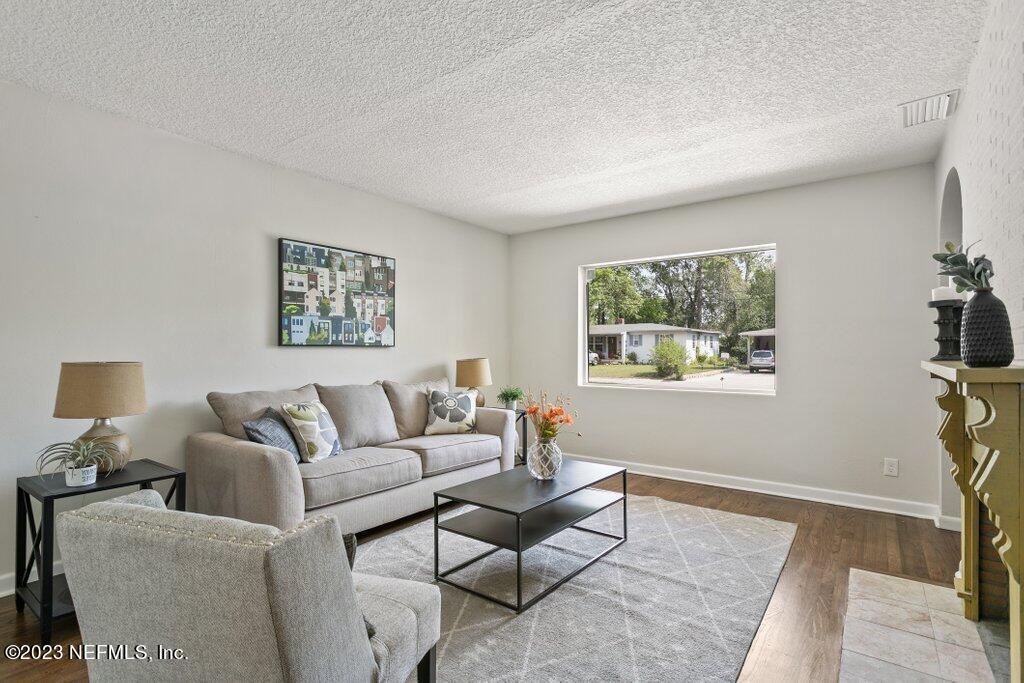 6404 Wesleyan Road Jacksonville, FL 32217 - Photo 10 of 45 a living room with furniture and a window