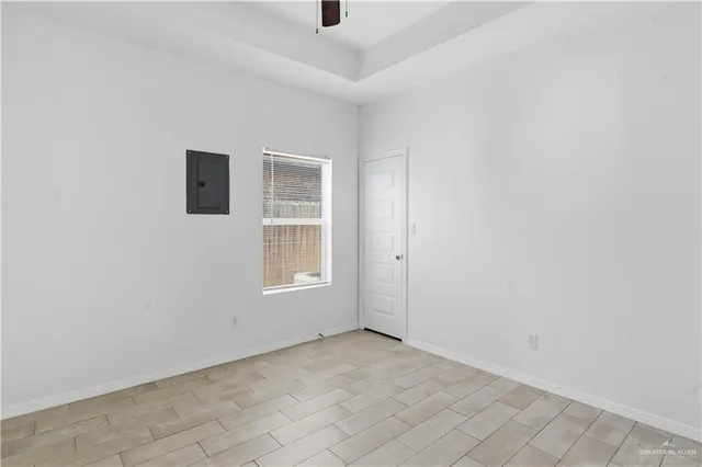 an empty room with windows and pillars in it