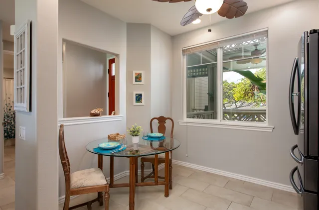 a dining room with furniture and a window