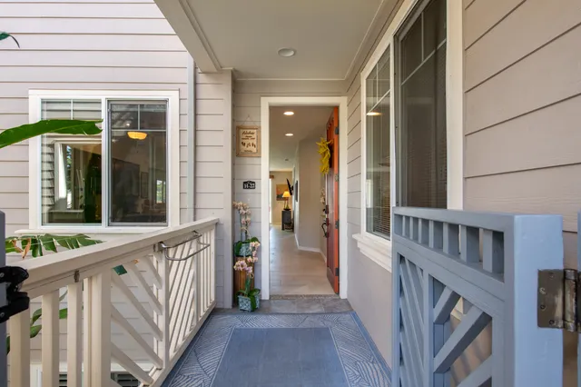 a view of a house with backyard and porch