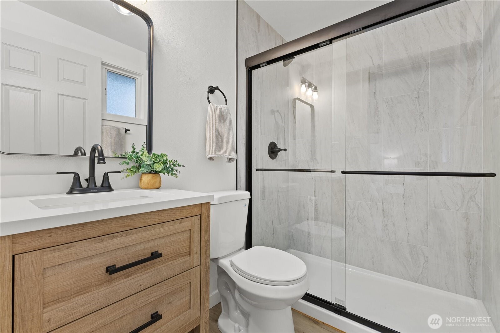 34515 25th Avenue Southwest Federal Way, WA 98023 - Photo 12 of 31 a bathroom with a sink a toilet and shower