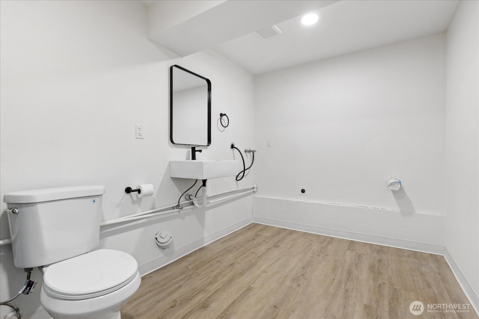 34515 25th Avenue Southwest Federal Way, WA 98023 - Photo 20 of 31 a bathroom with a sink a toilet and mirror