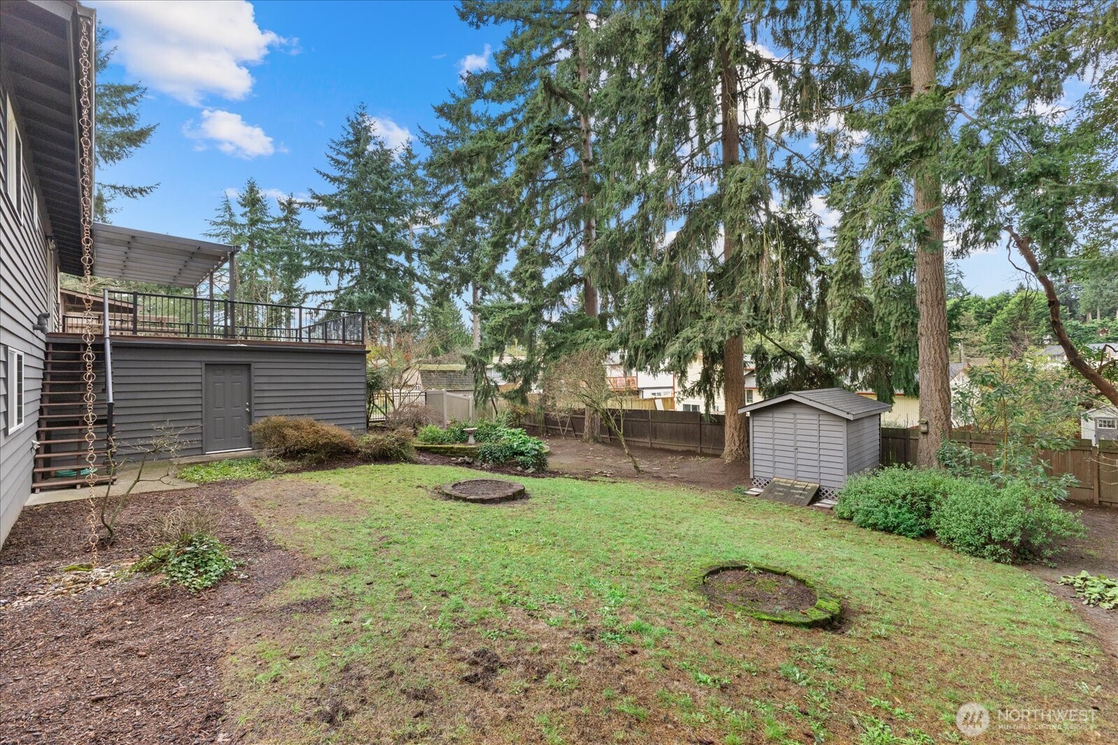 34515 25th Avenue Southwest Federal Way, WA 98023 - Photo 23 of 31 a backyard of a house with table and chairs