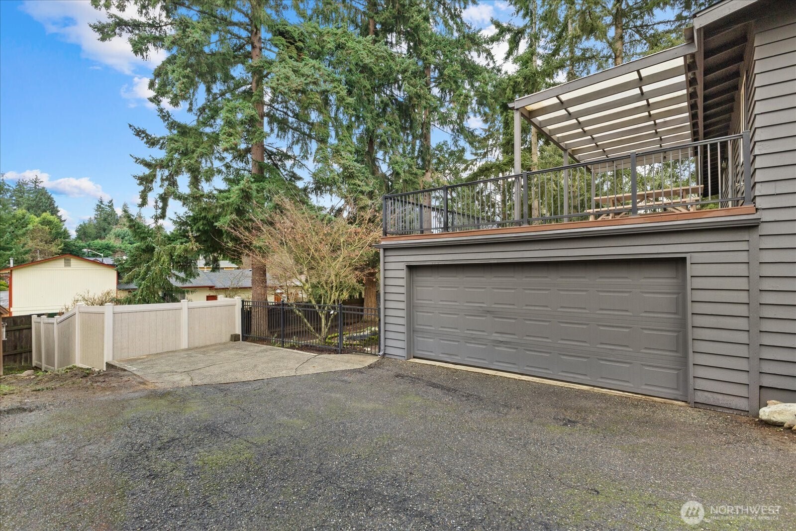 34515 25th Avenue Southwest Federal Way, WA 98023 - Photo 26 of 31 a back view of a house with a tree