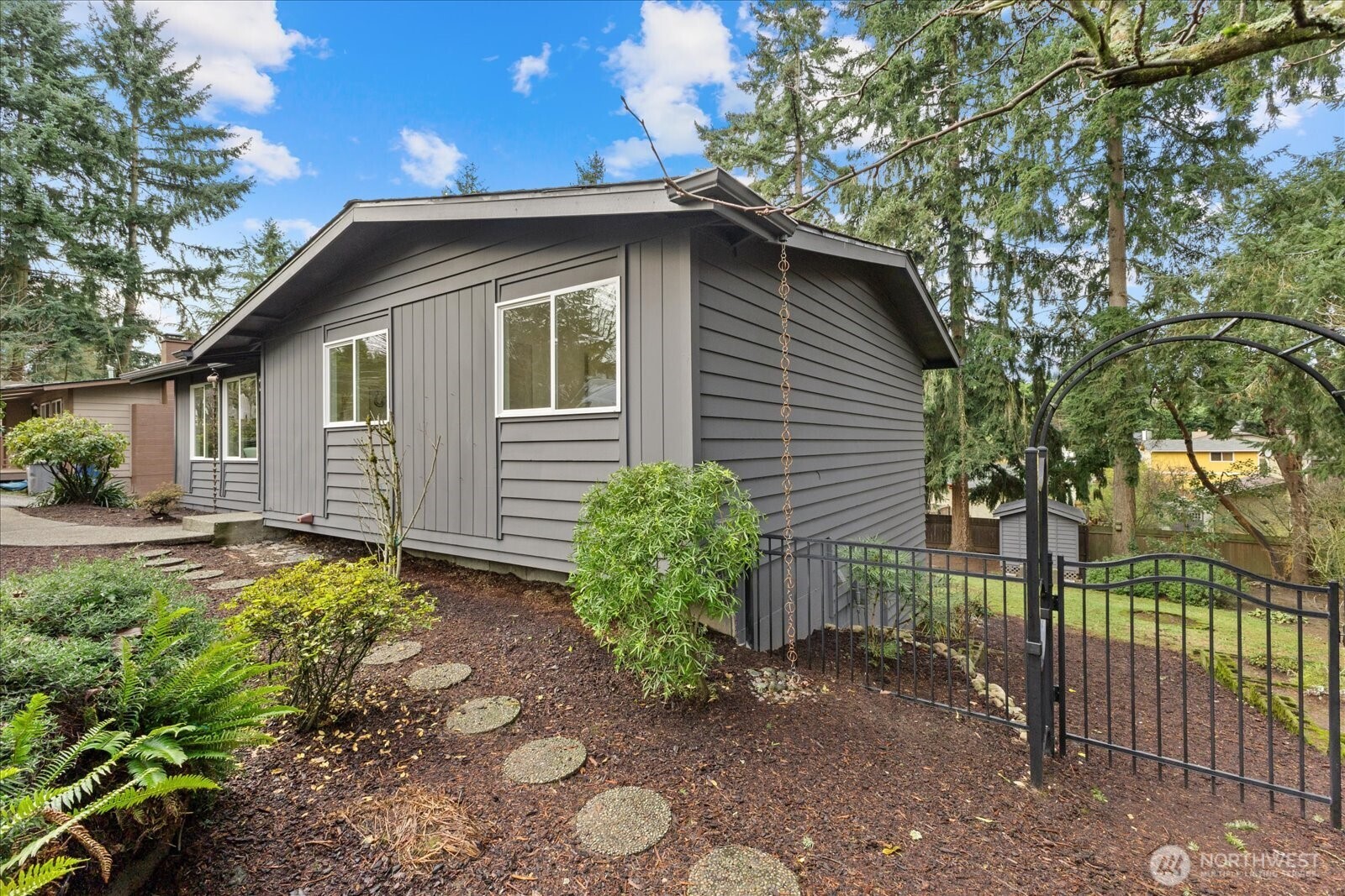 34515 25th Avenue Southwest Federal Way, WA 98023 - Photo 27 of 31 a yellow house with trees in front of it