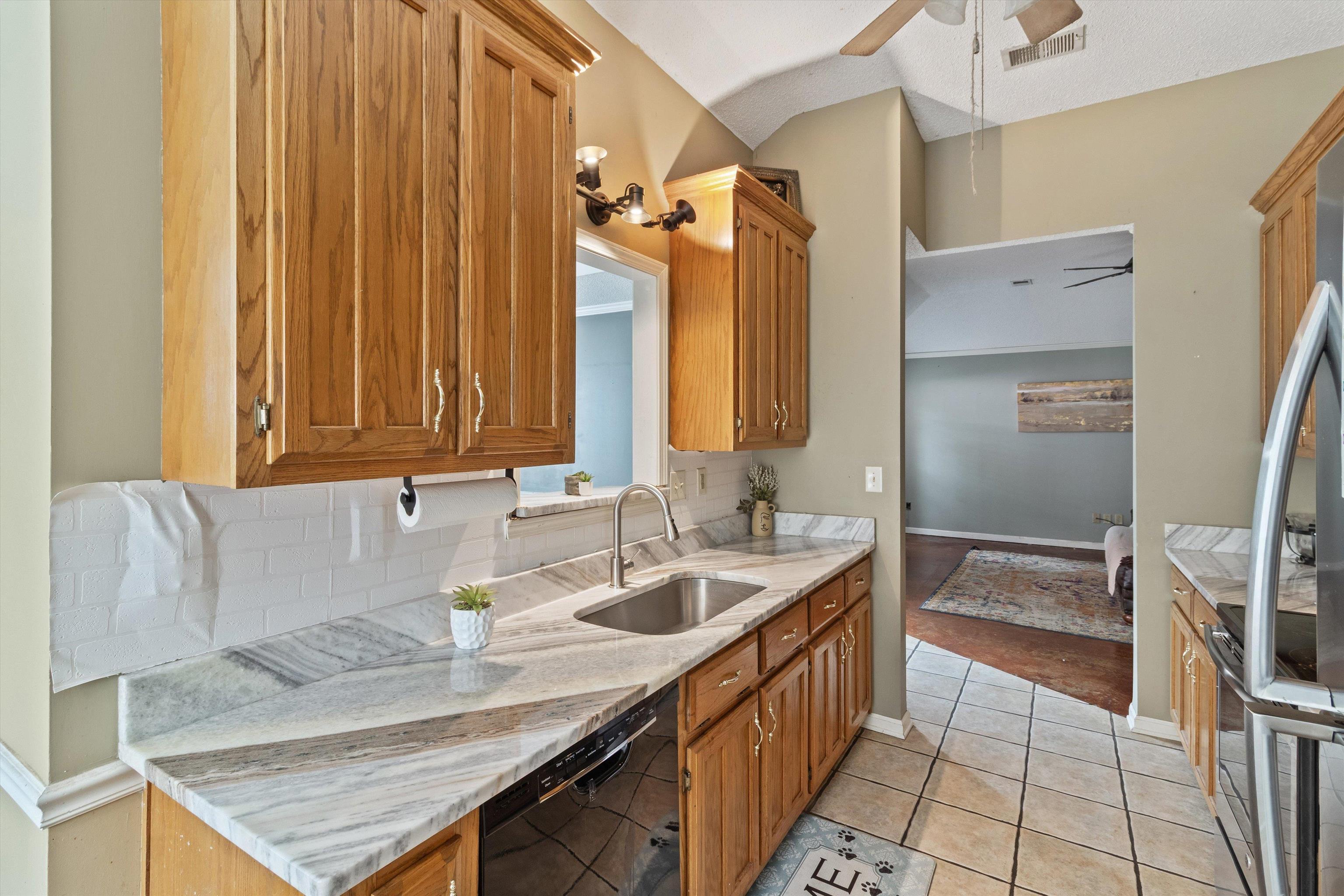 6712 Booth Forrest Drive Bartlett, TN 38135 - Photo 12 of 27 a bathroom with a tub sink and mirror