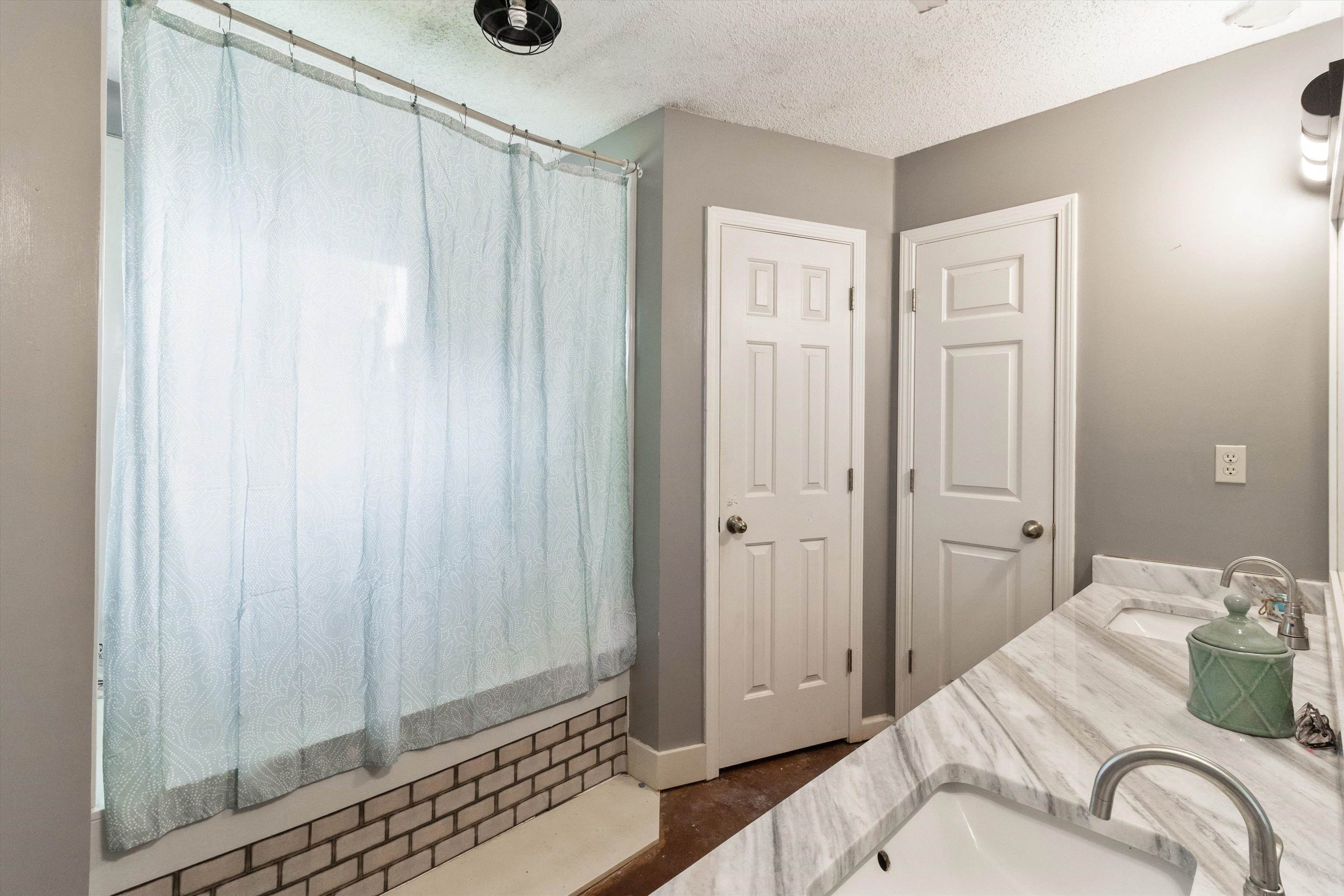 6712 Booth Forrest Drive Bartlett, TN 38135 - Photo 19 of 27 a bedroom with a bed and a shower