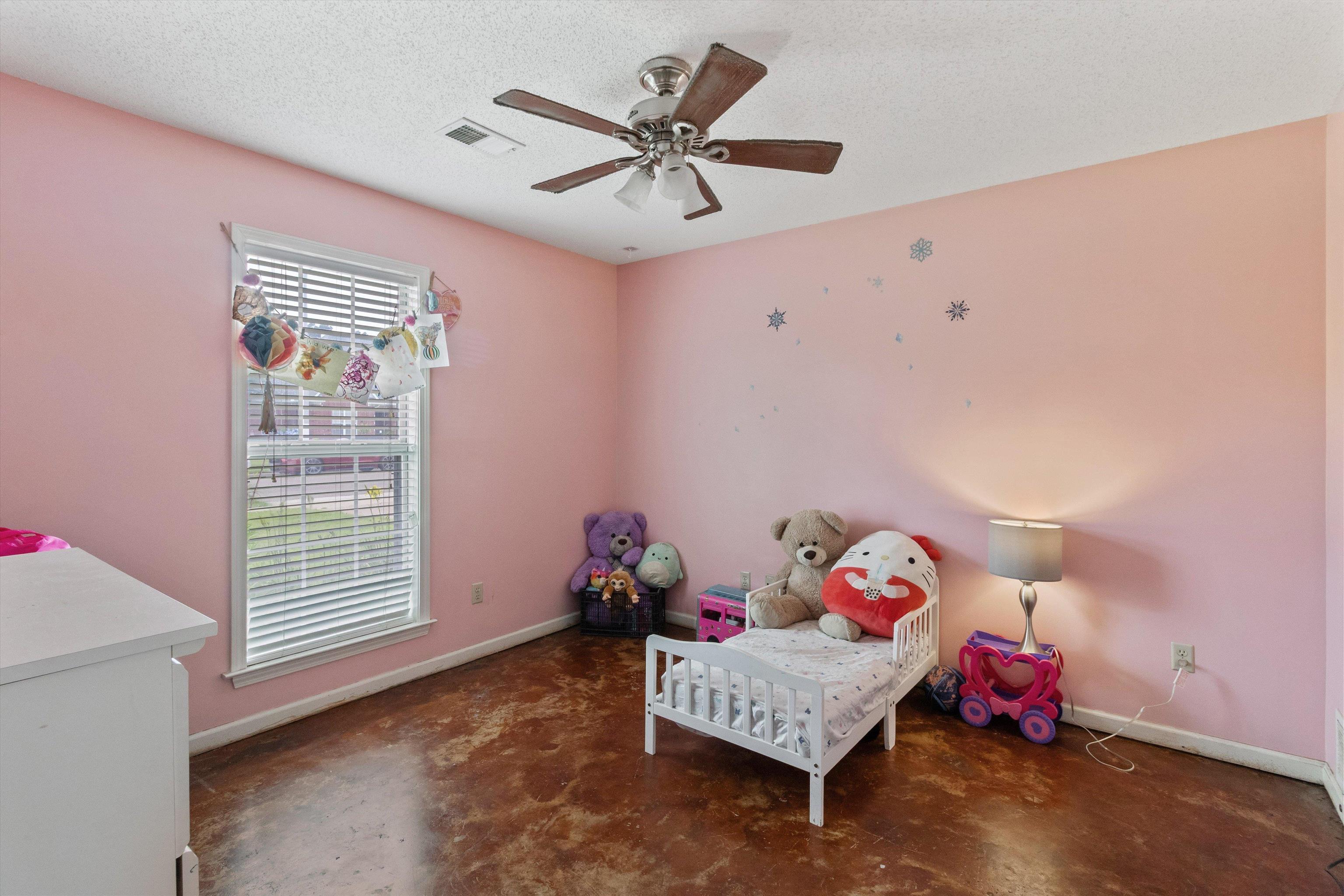 6712 Booth Forrest Drive Bartlett, TN 38135 - Photo 21 of 27 a living room with furniture and a window