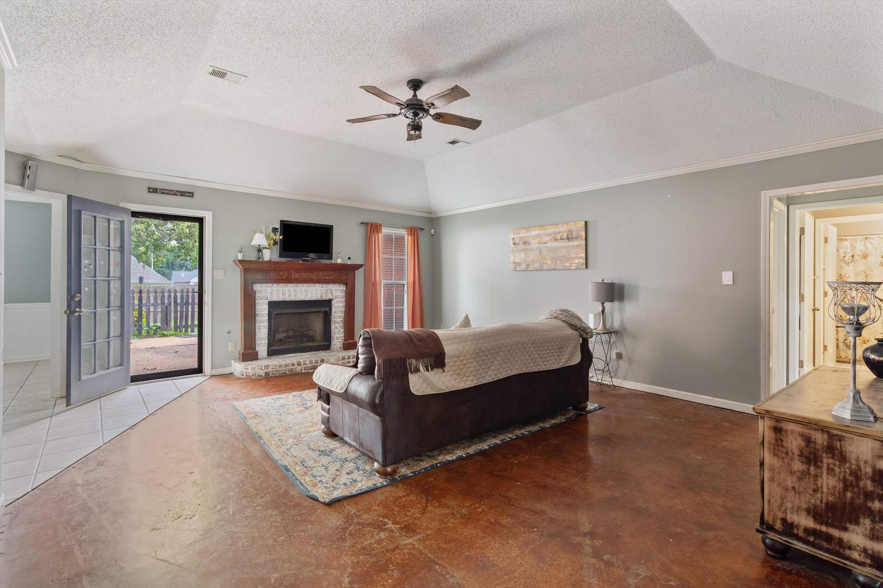 6712 Booth Forrest Drive Bartlett, TN 38135 - Photo 6 of 27 a living room with furniture and a fireplace