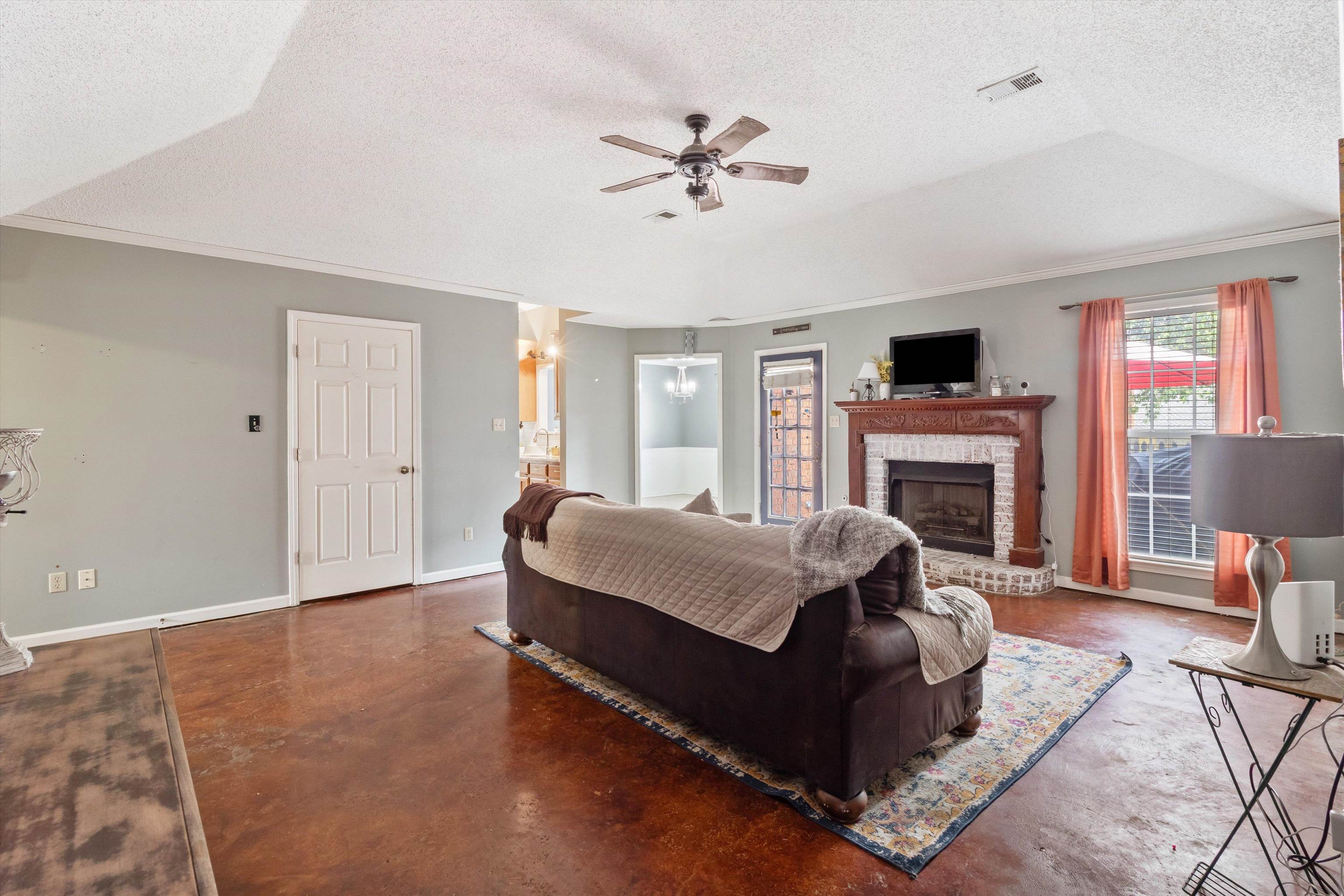 6712 Booth Forrest Drive Bartlett, TN 38135 - Photo 7 of 27 a living room with furniture and a fireplace