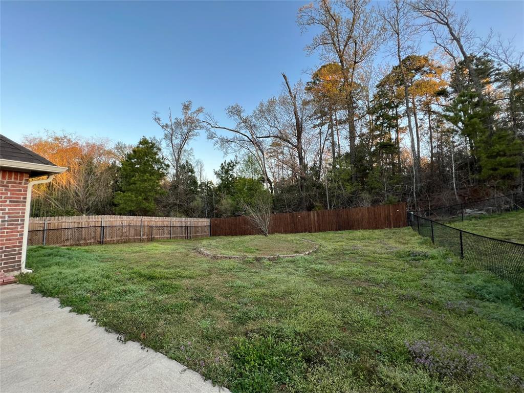 513 Fox Cove Haughton, LA 71037 - Photo 13 of 15 a backyard of a house with lots of green space
