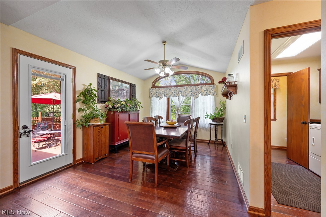 10400 Stoneacre Road Northwest Canal Fulton, OH 44614 - Photo 12 of 44 Dining space with dark wood-style floors, healthy amount of natural light, ceiling fan, and vaulted ceiling