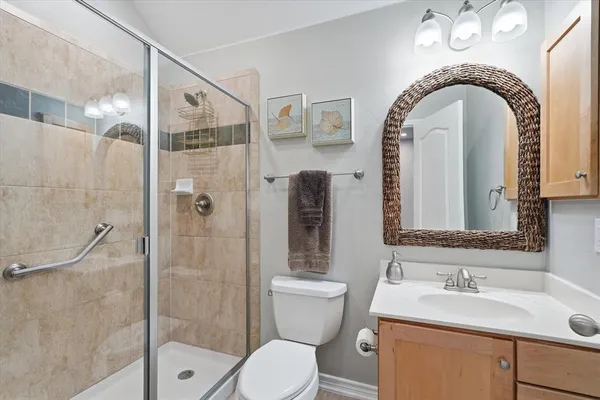 a bathroom with a toilet sink and shower
