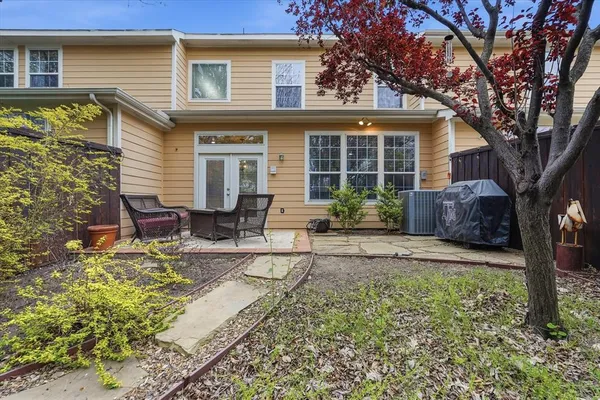 a house view with a sitting space and garden space