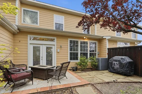 a view of a patio with a chairs and table in a patio