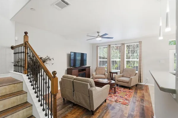 a living room with furniture fireplace and a flat screen tv