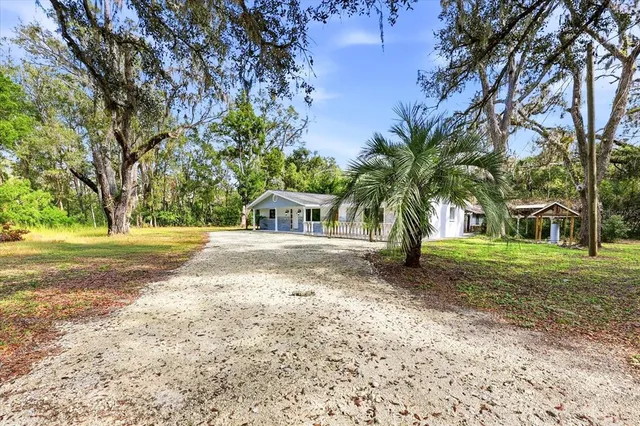 a view of a electric appliances in kitchen and an empty room