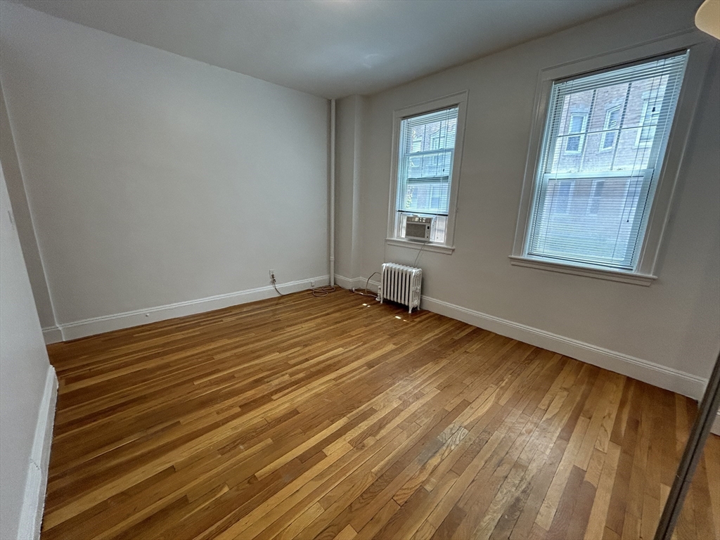 48 Strathmore Road, Unit 4 Boston, MA 02135 - Photo 2 of 10 a view of a room with wooden floor and windows