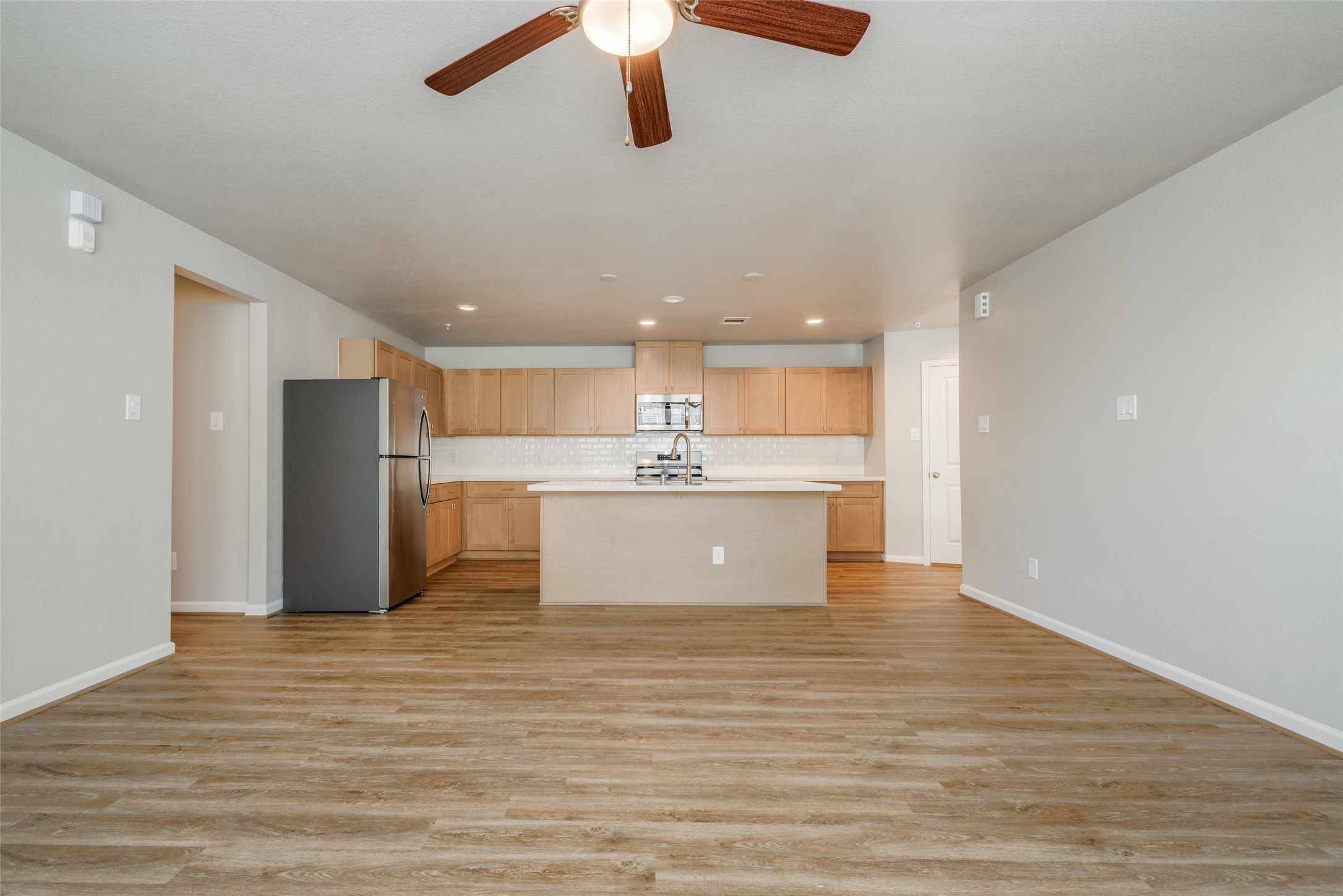 239 Park Place Circle, Unit D Waller, TX 77484 - Photo 7 of 17 a large kitchen with a refrigerator and window