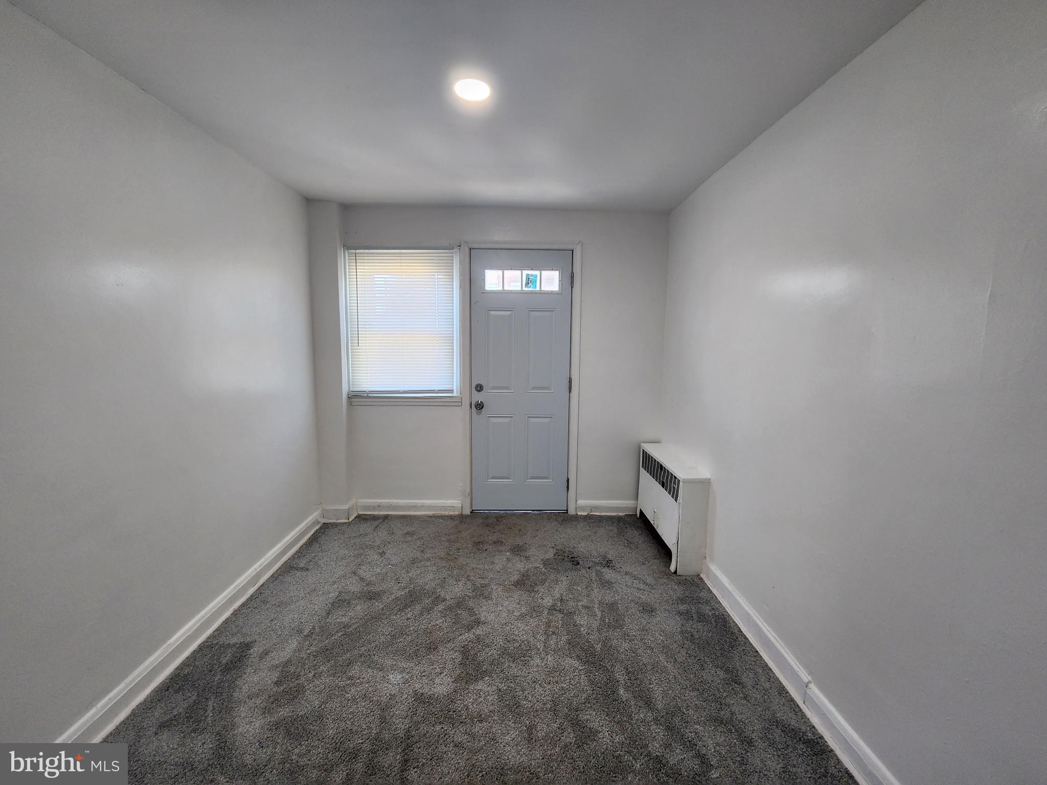 3507 Pelham Avenue Baltimore, MD 21213 - Photo 11 of 36 an empty room with a empty space and windows