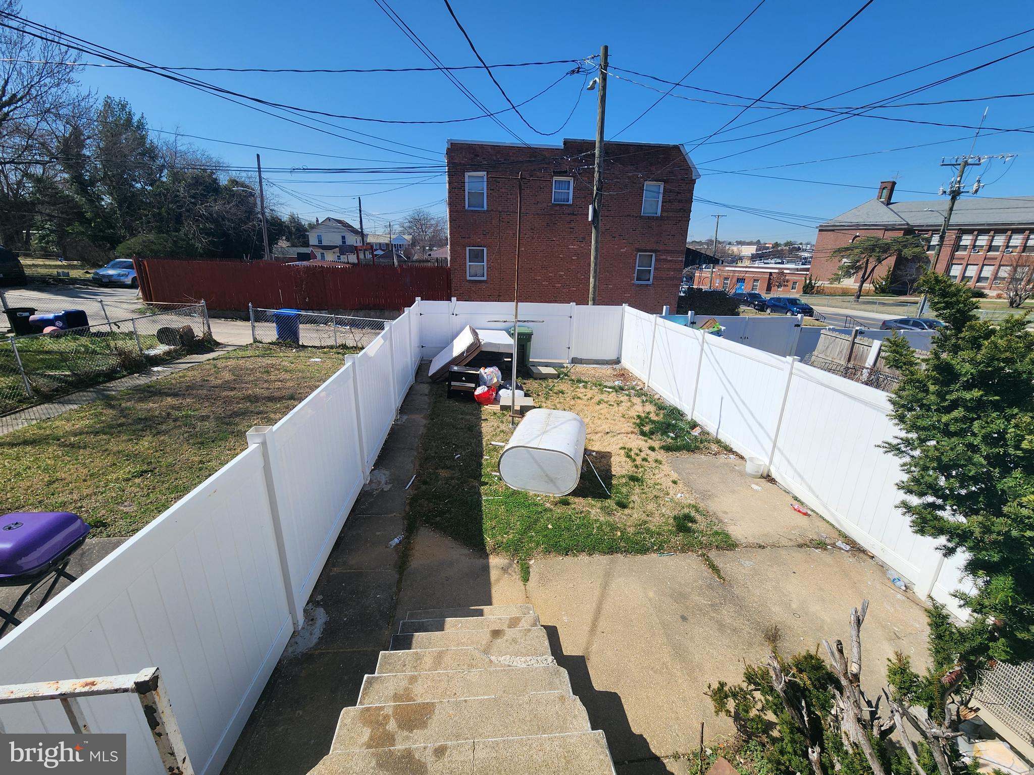 3507 Pelham Avenue Baltimore, MD 21213 - Photo 13 of 36 a view of a patio with couches chairs potted plants and a table