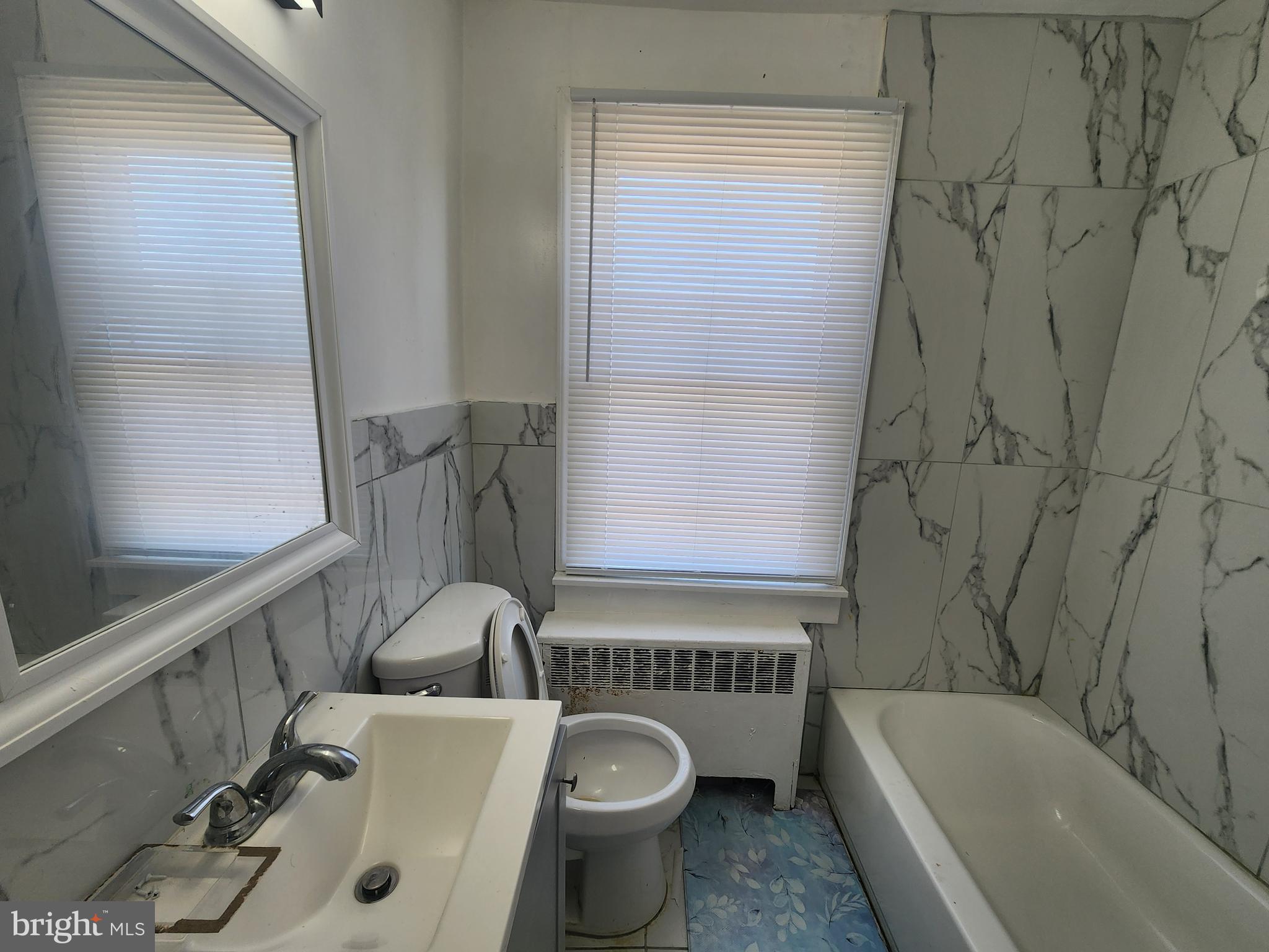 3507 Pelham Avenue Baltimore, MD 21213 - Photo 24 of 36 a bath room with a toilet and a bath tub