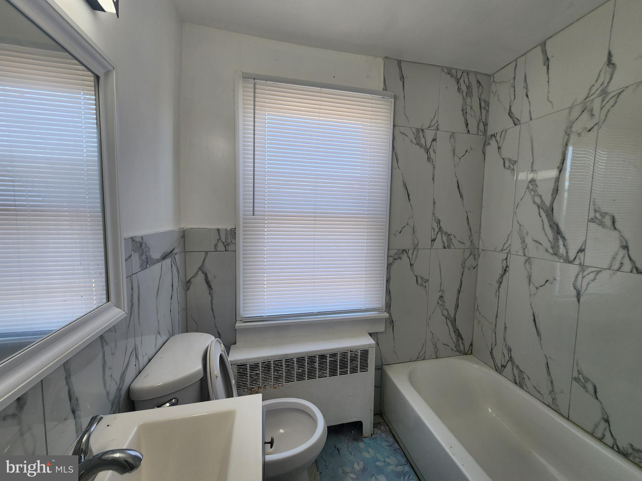 3507 Pelham Avenue Baltimore, MD 21213 - Photo 25 of 36 a bathroom with a bathtub and a toilet