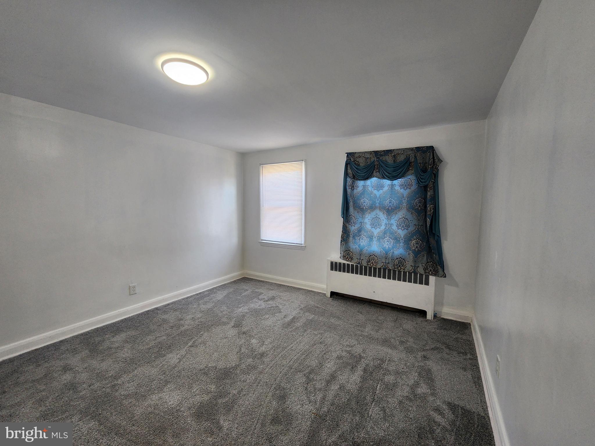 3507 Pelham Avenue Baltimore, MD 21213 - Photo 27 of 36 an empty room with windows and closet