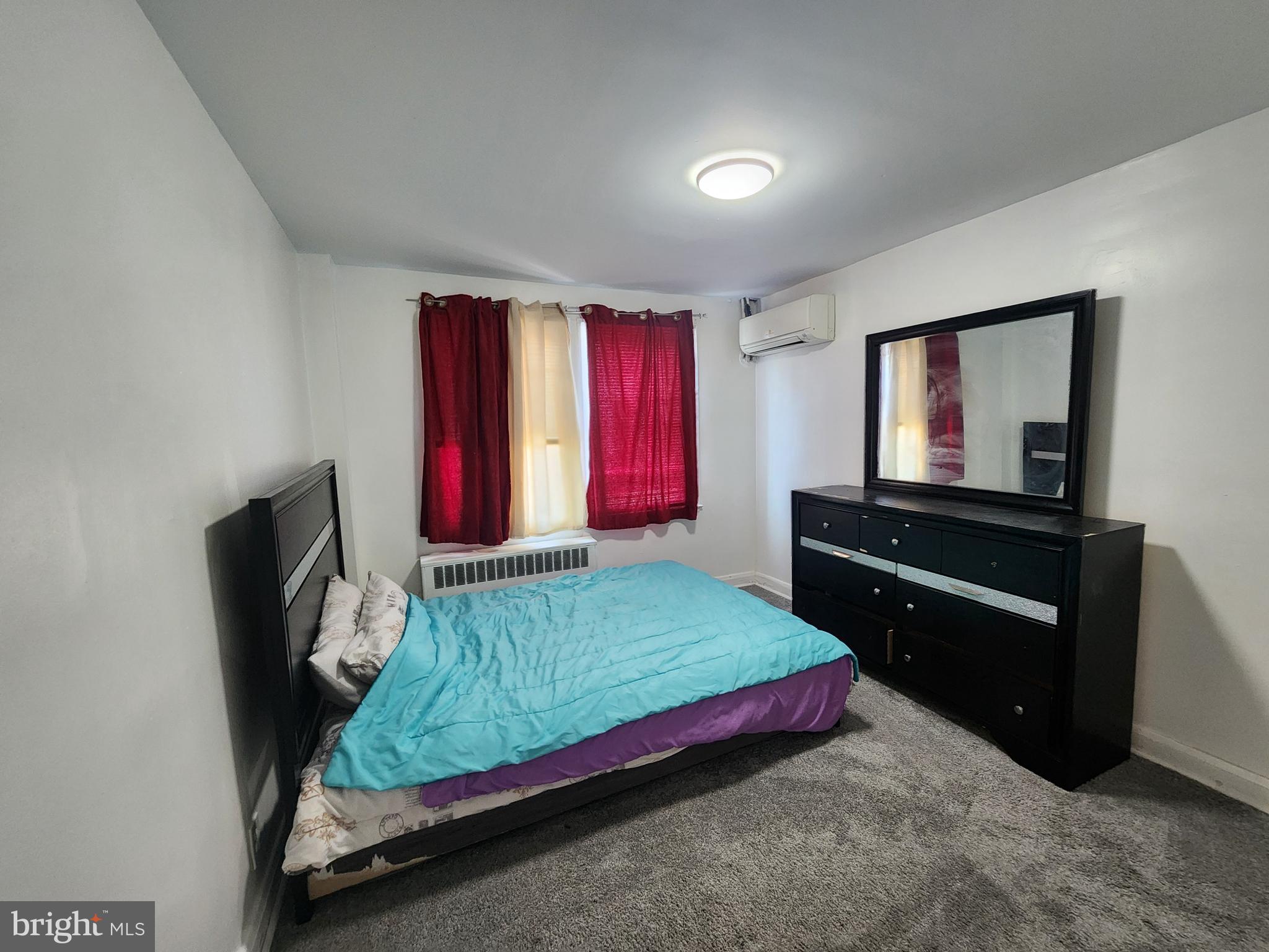 3507 Pelham Avenue Baltimore, MD 21213 - Photo 29 of 36 a bedroom with a bed and a television
