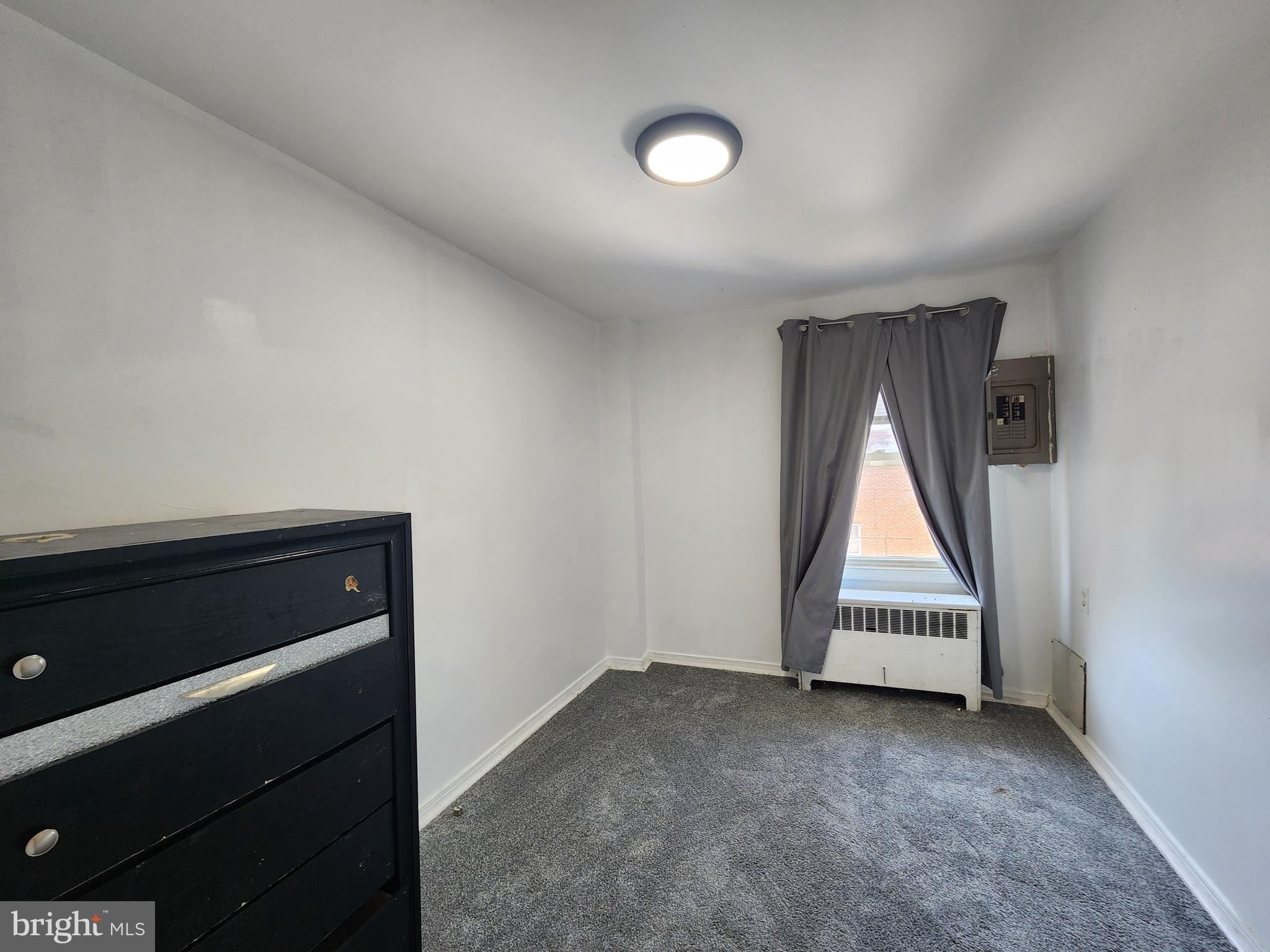 3507 Pelham Avenue Baltimore, MD 21213 - Photo 33 of 36 an empty room with wooden floor and windows