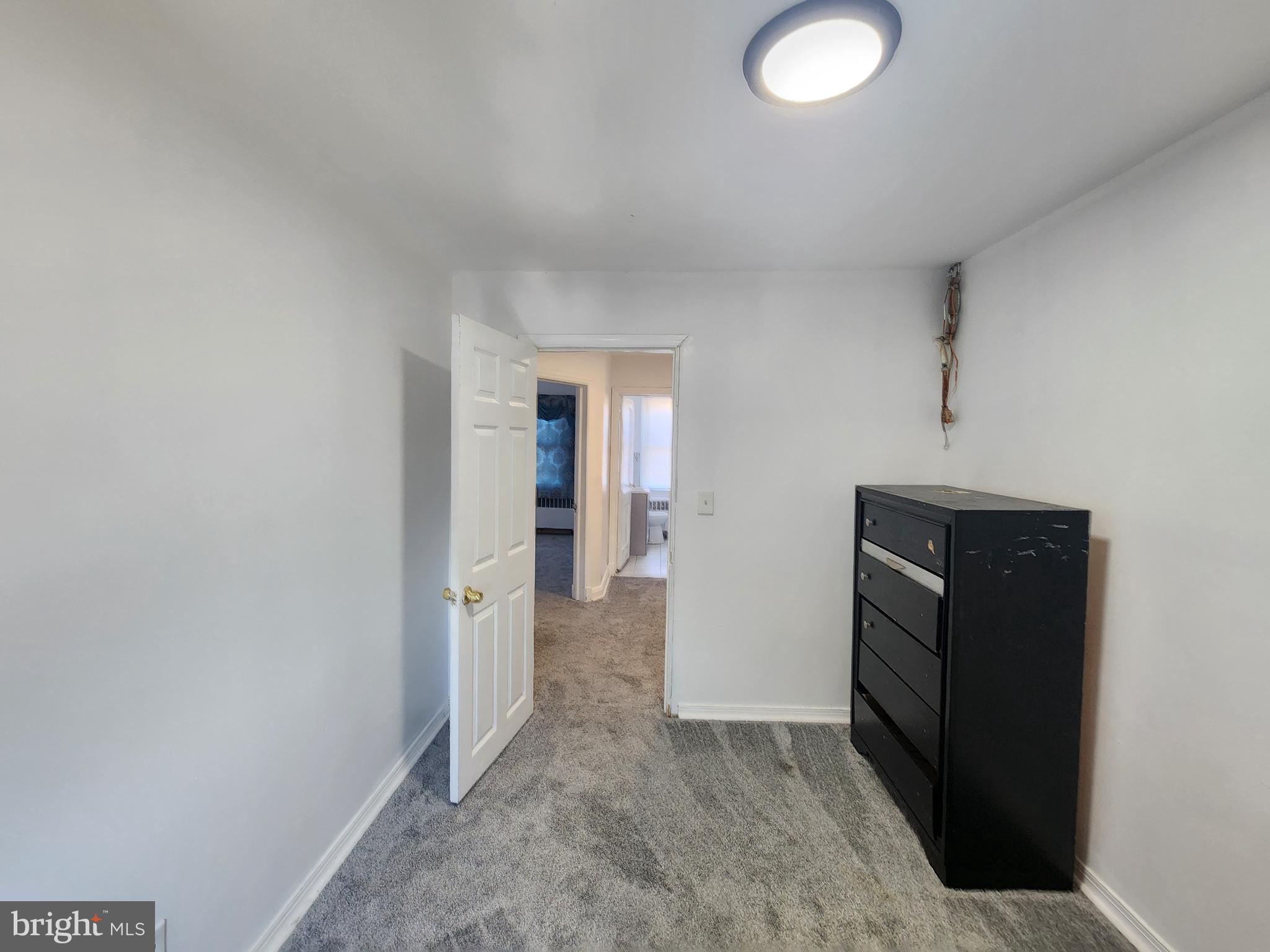 3507 Pelham Avenue Baltimore, MD 21213 - Photo 34 of 36 wooden floor and cabinet in a room