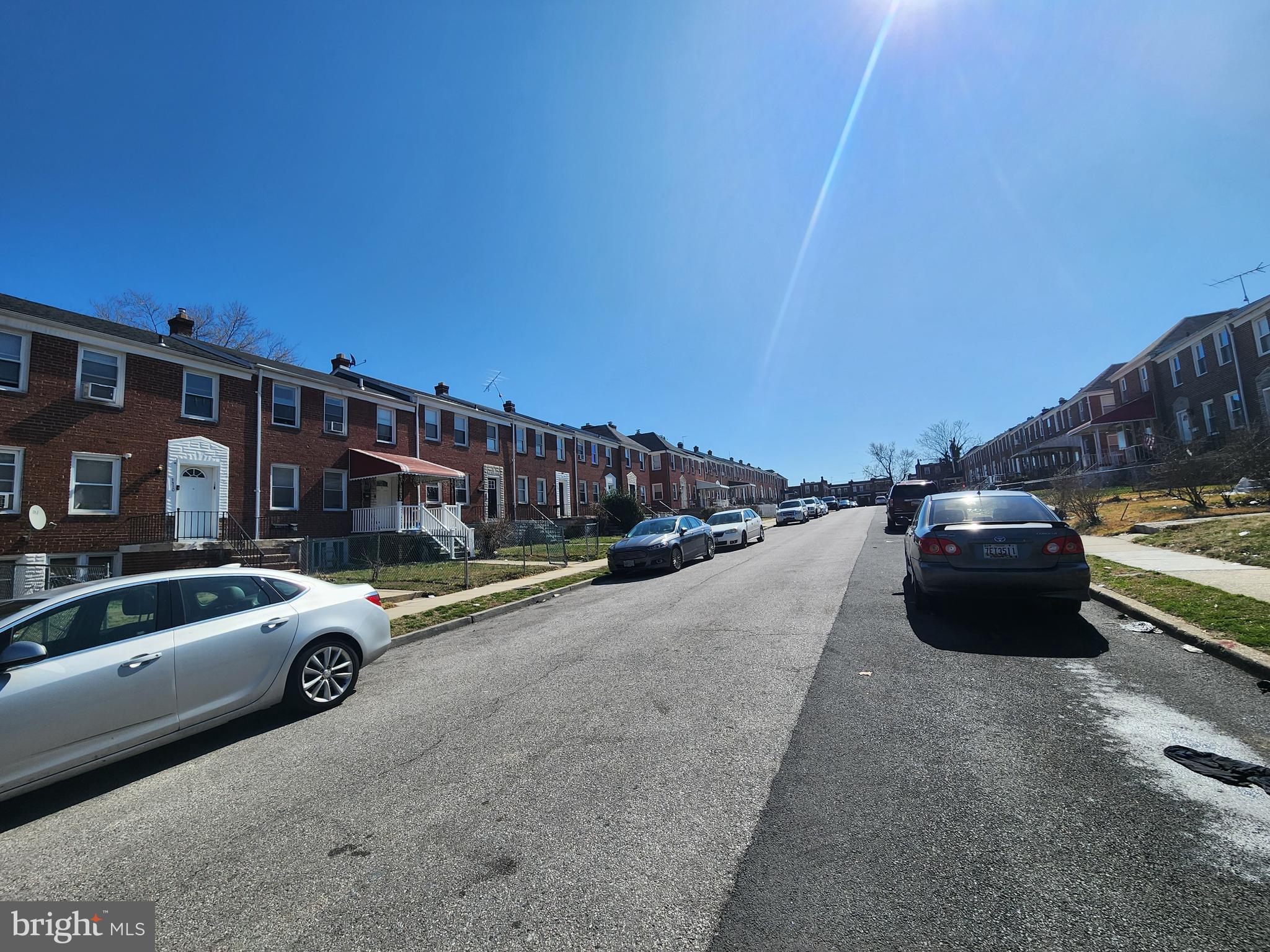 3507 Pelham Avenue Baltimore, MD 21213 - Photo 36 of 36 a view of a street that has parked cars