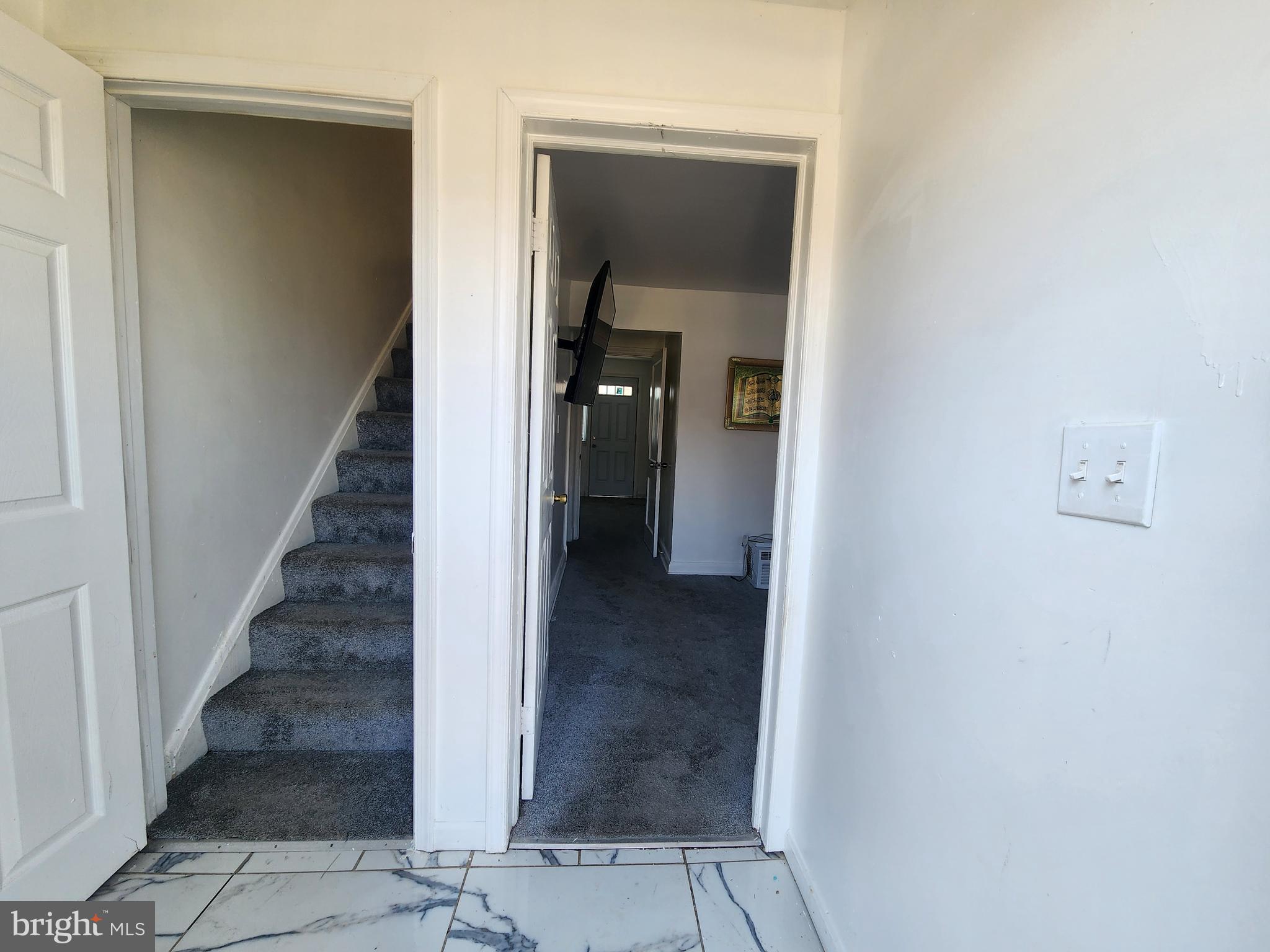 3507 Pelham Avenue Baltimore, MD 21213 - Photo 6 of 36 a view of a hallway with wooden floor and entryway