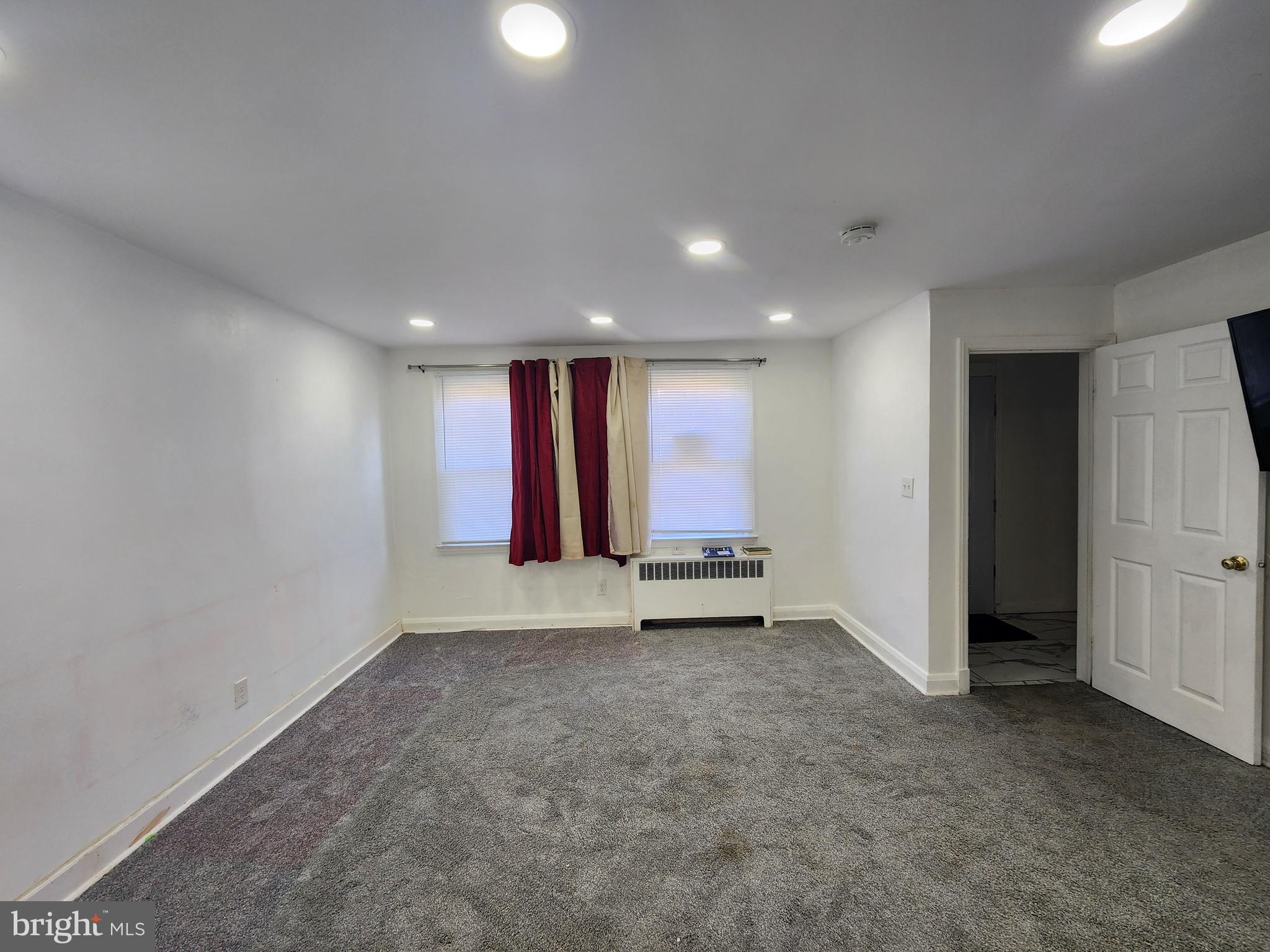 3507 Pelham Avenue Baltimore, MD 21213 - Photo 9 of 36 a view of an empty room with a window