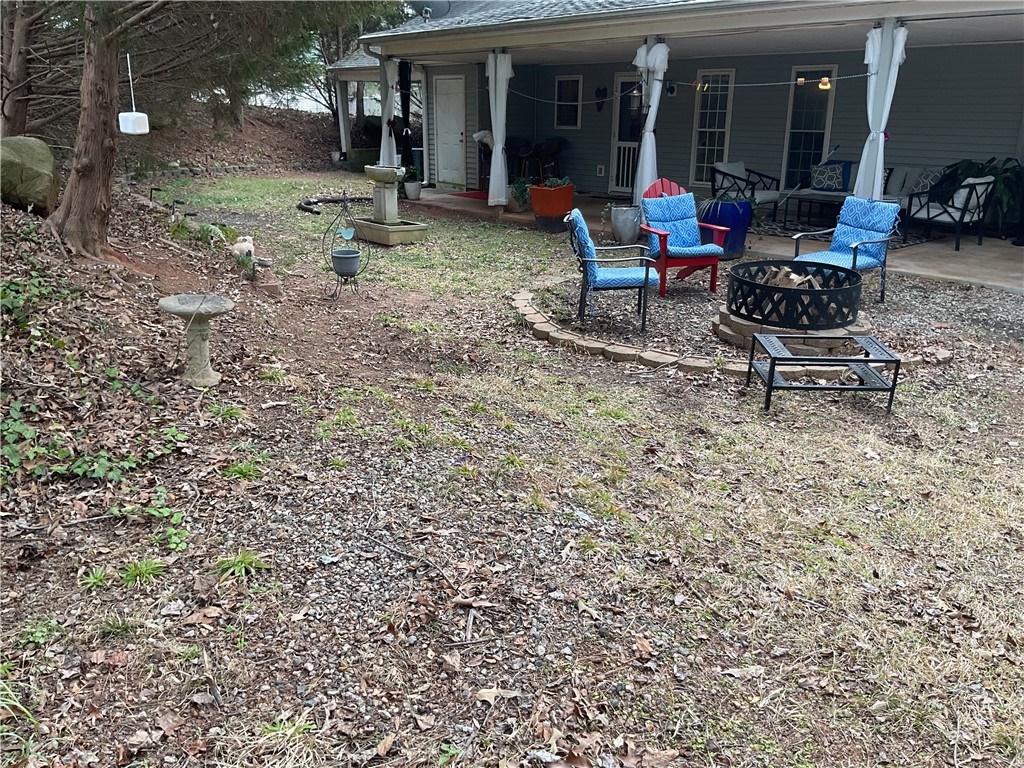 229 Cub Cove Drive Walhalla, SC 29691 - Photo 50 of 50 Enjoy outdoor gatherings on the patio with a cozy fire pit.