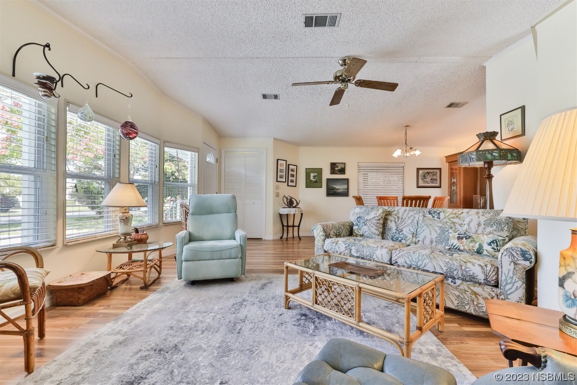 806 Navigators Way Edgewater, FL 32141 - Photo 16 of 59 a living room with furniture and a large window