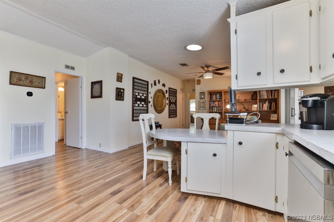 806 Navigators Way Edgewater, FL 32141 - Photo 22 of 59 a living room with furniture and wooden floor